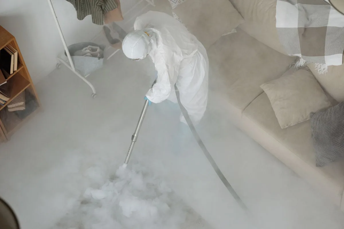 Biohazard cleanup technician in protective equipment, Amityville, NY